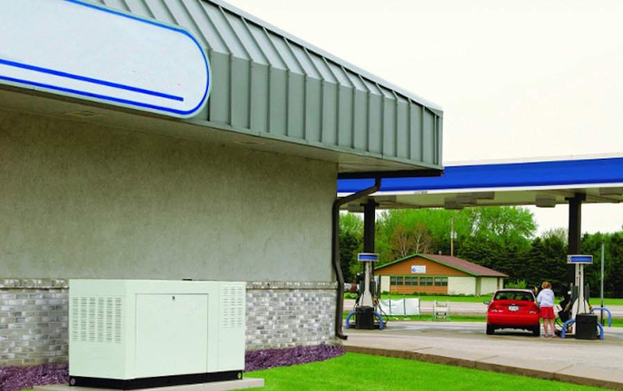 Backup diesel generator installed beside a supermarket building