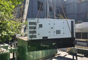 Industrial standby diesel generator installed outside manufacturing facility