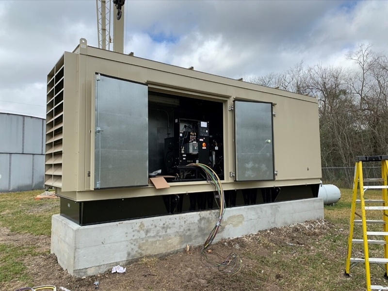 Standby diesel generator installed outside a commercial facility for emergency backup power