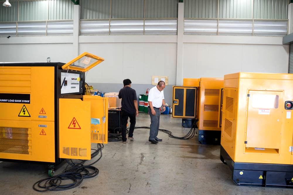 diesel generator load bank testing in factory workshop with portable load bank connected during commissioning