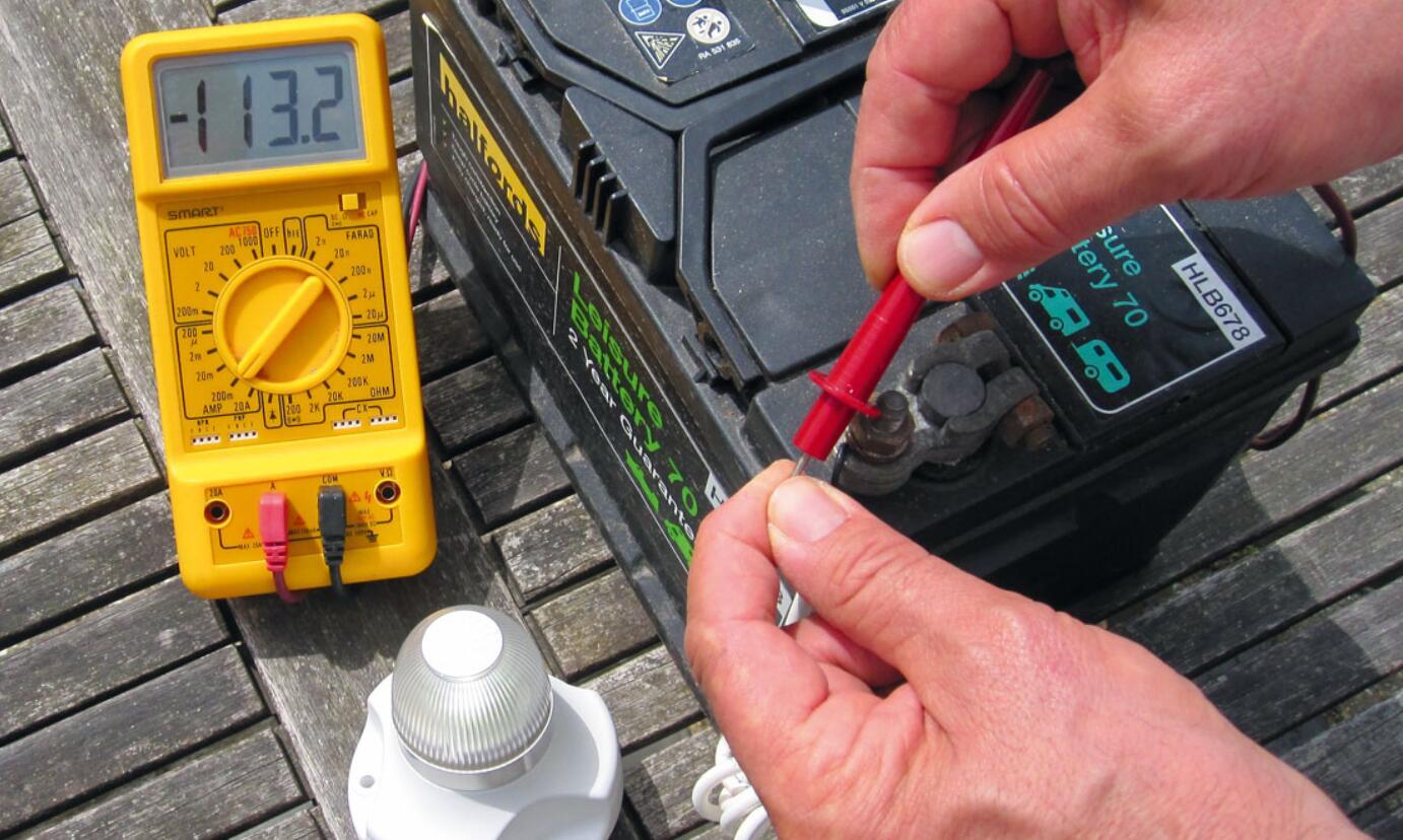 checking diesel generator battery voltage with multimeter