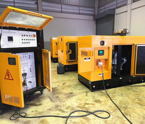 diesel generator connected to a portable load bank during load testing